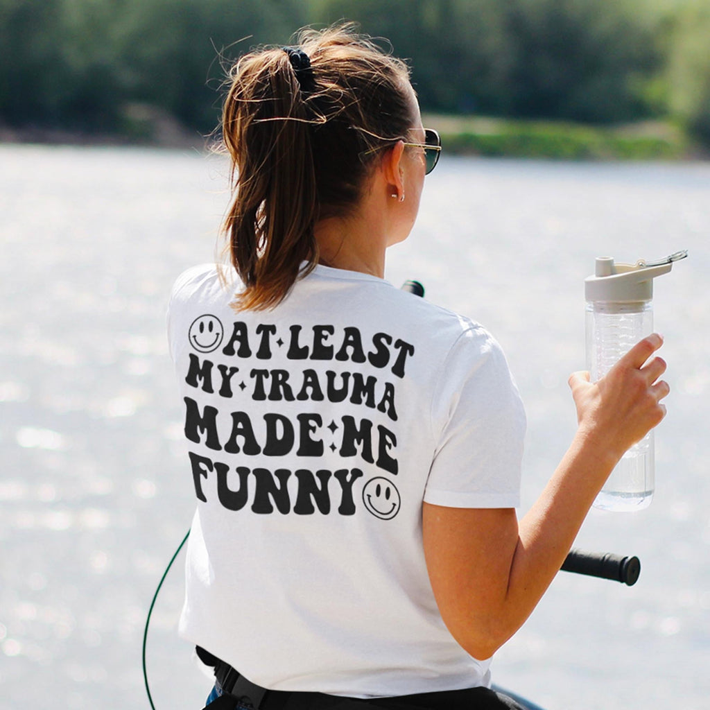 Sandjest Funny T-Shirt at Least My Trauma Made Me Funny Gift for Friend Woman Girl